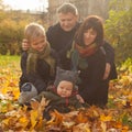 Family love, care and positive relations. Parents mom and daddy with two sons together, autumn portrait