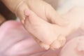 Hand baby hand mother closeup concept love family