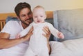 Family, love and father with baby in bedroom for bonding, relationship and care for parenting. Happy, home and dad Royalty Free Stock Photo