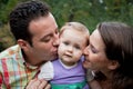 Family love - parents kiss for daughter Royalty Free Stock Photo
