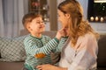 Happy smiling mother talking to her son at home Royalty Free Stock Photo