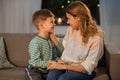 Happy smiling mother talking to her son at home Royalty Free Stock Photo