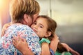 Family love. Portrait of an adorable little girl hugging her grandmother at home. Royalty Free Stock Photo