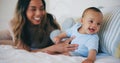 Family, love and a woman on the bed with her baby in their home together for care or bonding. Children, smile and a Royalty Free Stock Photo