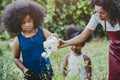 Family lovely gardening watering green plant activity with children during Stay at Home to reduce the outbreak of the Coronavirus