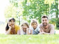 Family lying down in grass Royalty Free Stock Photo