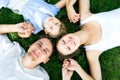 Family lying on grass Royalty Free Stock Photo