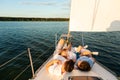 Family Lying On Yacht Deck Relaxing On Sailboat Ride Royalty Free Stock Photo