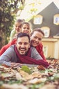 Family make people pyramid. Autumn season. Looking at camera. Royalty Free Stock Photo