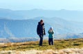 Family make photo on autumn mountain plateau Royalty Free Stock Photo