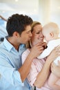 Family makes this house a home. a happy family looking contented at home.