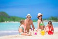 Family making sand castle at tropical white beach Royalty Free Stock Photo