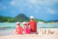 Father and little kid making sand castle at tropical beach Royalty Free Stock Photo