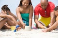 Family making sandcastles