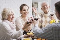 Family making a toast at dinner Royalty Free Stock Photo