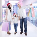 Family in the malll with shopping bags Royalty Free Stock Photo