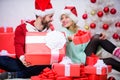 Family married couple at home. Couple in love enjoy winter holiday celebration. Woman and bearded man in love sit near