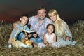 Family in the meadow at night