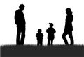 Family on meadow silhouette Royalty Free Stock Photo