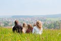 Family on meadow in spring or early summer Royalty Free Stock Photo