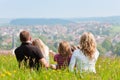 Family on meadow in spring or early summer Royalty Free Stock Photo