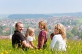 Family on meadow in spring or early summer