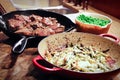 A family meal of lamb, peas, and cheesed asparagus