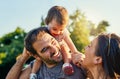 Family means everything to us. a young family outdoors.