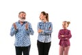 Family members arguing with one another on white studio background. Royalty Free Stock Photo