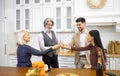 Family members clinking champagne glasses during birthday celebration Royalty Free Stock Photo