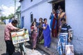 Family members eating ice cream from a small vendor