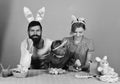 Family members wear bunny ears. Mother, daughter and bearded father Royalty Free Stock Photo