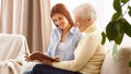 Family memories. Mother and daughter looking album Royalty Free Stock Photo