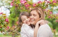 Happy mother and daughter hugging over garden Royalty Free Stock Photo