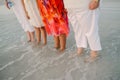 Family of Women Standing Facing the Ocean in Shallow Water Shoreline at the Beach on Vacation Outside in Nature