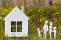 Mom, dad, daughter, son and paper house