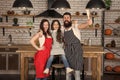 Family mom dad and daughter wear aprons stand in kitchen. Cooking food concept. Prepare delicious meal. Breakfast time Royalty Free Stock Photo