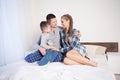 The family morning in the bedroom on the bed mom dad son Royalty Free Stock Photo