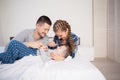 The family morning in the bedroom on the bed mom dad son Royalty Free Stock Photo
