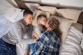 The family morning in the bedroom on the bed mom dad son Royalty Free Stock Photo