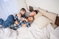 The family morning in the bedroom on the bed mom dad son Royalty Free Stock Photo