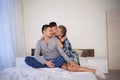 The family morning in the bedroom on the bed mom dad son Royalty Free Stock Photo