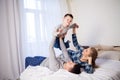 The family morning in the bedroom on the bed mom dad son Royalty Free Stock Photo