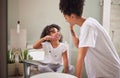 Family morning, dental cleaning and mother teaching child to brush teeth in bathroom, care for mouth health and smile Royalty Free Stock Photo