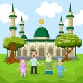 Family moslem standing in front of big Mosque