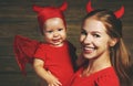 Family mother and baby son celebrate Halloween in devil costume Royalty Free Stock Photo