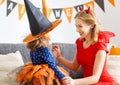 Family mother and child daughter getting ready for halloween,