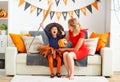 Family mother and child daughter getting ready for halloween,