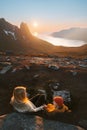 Family mother and child sitting in camping chairs outdoor travel in Norway mountains mom with daughter hiking together