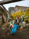 Family mother with daughter child swings on swing having fun outdoor traveling together active vacations in Norway